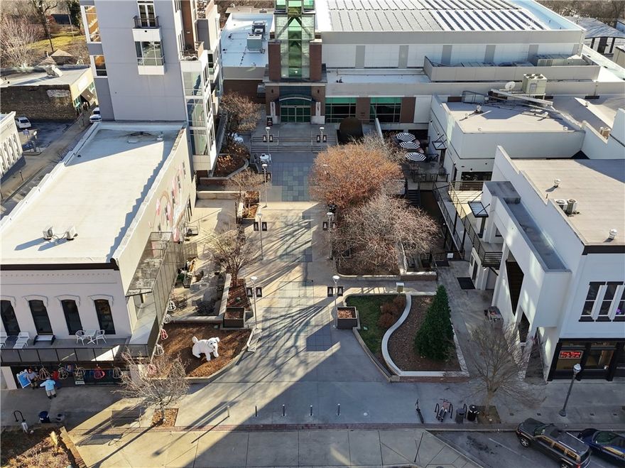 +/- 1,000 of flexible office/retail space with glass front storefront opening to beautiful courtyard in iconic Downtown Fayetteville Square! This space offers a large co-working space, private office, private bathroom, new paint, modern LED flat panel lighting, and new trim. Located in the same building as Tiny Tim's Pizza, right next door to Jammin Java, and just up the street from Hugo's Restaurant, there are many great places to grab lunch or visit on break. Private parking spots available in attached parking garage for $200/mo with elevator access to street and other businesses. If your looking for a private and modern office space in the heart of Fayetteville, this is the space you are looking for!