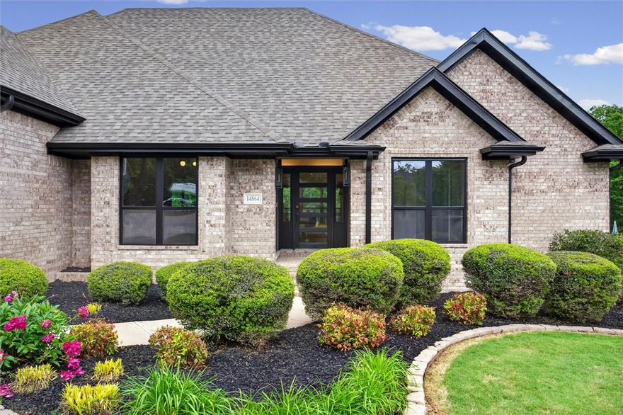 Welcome to 14864 Park Ridge Drive in Lowell, Arkansas, a custom-built home on a peaceful 0.54-acre lot in a serene rural setting. With plenty of space, this 4-bed, 3-bath home offers an open-concept layout with vaulted ceilings, abundant natural light, & wood flooring throughout, no carpet anywhere. The living area features a fireplace with built-ins, while the chef’s kitchen includes granite countertops, an oversized island, & a bright eat-in space with large windows & scenic views. A second living area or office sits just off the entry, adding flexibility. The spacious primary suite includes a soaker tub, separate shower, built-in vanity, & dual closets. Step outside to enjoy the large balcony & covered patio overlooking the picturesque yard, perfect for relaxing or entertaining. Comfort, efficiency, & space come together in this beautiful Lowell home.