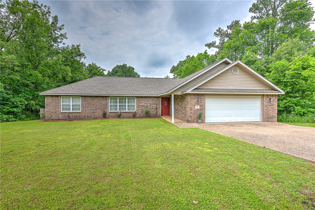 This well-maintained one owner home sits on a hard to find spacious level lot in Bella Vista. Nature & convenience collide as this home is just 1 mile from Hwy access connecting you to Bentonville, Rogers, and the rest of NWA. Walking distance to Lake Loch Lomond and Granton Park, this location offers access to nearby Biking trails, Golf Courses, Lakes, Kayaking, Sand Volleyball & the beach at Lake Avalon, Pickleball Courts, Indoor Swimming Pool, Workout Facilities, Shopping, & more. The spacious open backyard is surrounded by trees creating a serene, private, and peaceful experience or you can even hike right out of the backyard into the Bella Vista common property & enjoy an afternoon nature walk. The screened in back porch offers the perfect place to enjoy a good book or soak in the hot tub. This home also includes a Brand New HVAC as well as a Newer Roof that was installed in 2021.