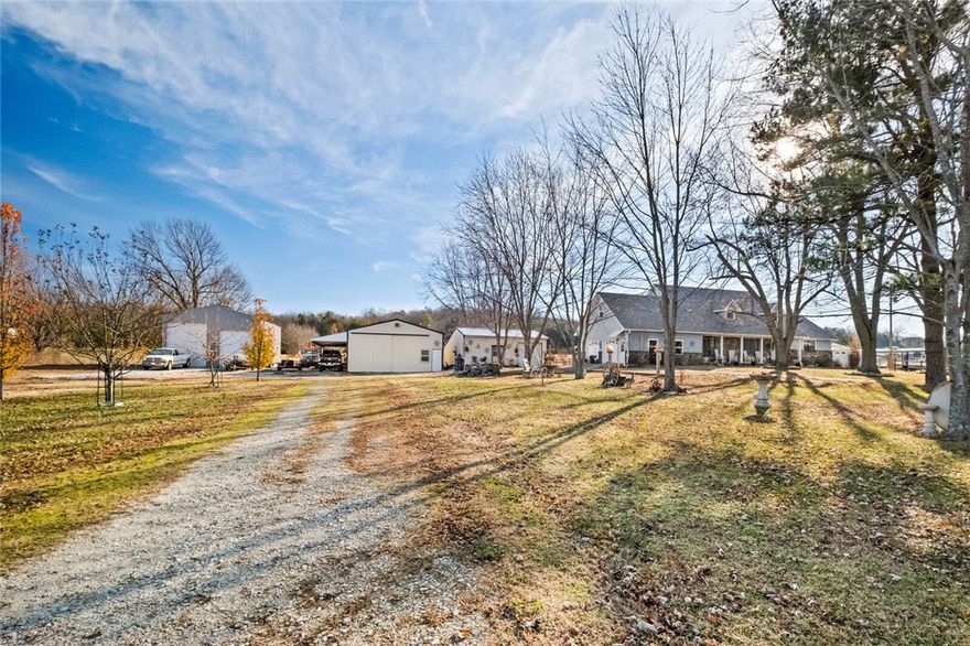 SELLER MOTIVATED!! Assumable FHA loan available at 3.125% 
Strategic Commercial Opportunity! Located in a rapidly growing industrial corridor with easy I-49 access, this 2.67-acre property is ideal for business expansion or launch. 
* No deed restrictions
* City water
* 2 septic tanks
* 3 oversized outbuildings provide versatile space
*  3-phase power at the road
*  Heated/cooled 30x60 shop (w/ office & bath)
*  30x40 RV/boat storage
*  30x24 shop/shed offer diverse possibilities

Plus, a separate spacious 3-bed apartment currently being used for AIRBNB with private entry provides great income potential or use it as your kids' first apartment!  Property is located outside of the city limits. Zoned for agriculture/residential.