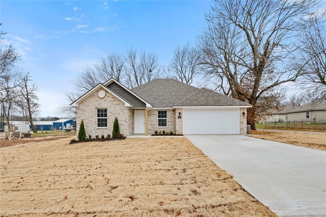 Don't miss this new ALL brick home conveniently located in Lincoln. Featuring four bedrooms and two bathrooms, this 1,566 square foot home offers an open floor plan with an oversized living room and eat-in kitchen. Thoughtfully designed with tray ceilings, to the ceiling kitchen cabinets, custom tiled shower in the primary bath, and 3 cm granite countertops throughout. A fully sodded yard, covered back patio, and wood privacy fence complete this must see home.