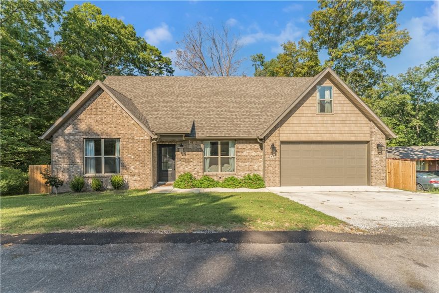 This stunning home features a striking catwalk that overlooks the living room, creating an open and elegant feel. The spacious primary suite is conveniently located on the main level, offering both comfort and ease of living. The kitchen is designed for both style and function, with under-cabinet lighting, 3cm granite countertops, a propane stove, and a walk-in pantry. Upstairs, you’ll find a thoughtful layout with a bedroom on each side of the home, each with its own walk-in closet, and a full bathroom in between to ensure privacy for family or guests. Above the garage, a versatile bonus room awaits, perfect for a game room, home office, or whatever fits your lifestyle. Step outside to the covered deck, the ideal spot to entertain friends or simply unwind and enjoy the peaceful surroundings. Preferred lender credit up to $2,500.