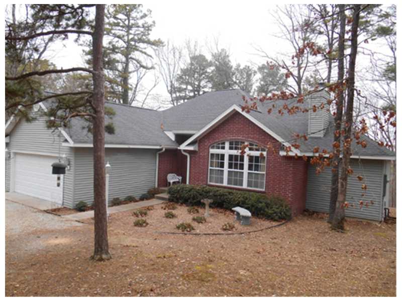 Well-built modern home with open floor plan and main floor living. Wood-burning fireplace, palladium window, cathedral ceiling, new tile kitchen backsplash. Great deck overlooking wooded back yard with doors from dining room and both bedrooms.,Home is zoned C-2 commercial allowing for use as a small inn, tourist lodging or vacation home. Main level two car garage and lower level workshop. Secluded wooded setting yet in town. Walk to trolley stop, tea room and antique shop.