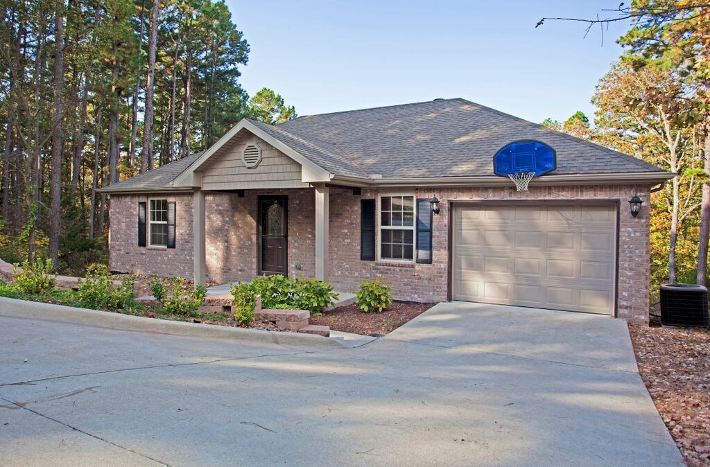 Delightful home in beautiful Bella Vista. Features include 2BD/2BA, 2 living areas, open floor plan, bamboo floors, brick fireplace, gourmet kitchen with large counter, pantry, granite countertops, and charming rock landscaping. Backyard is perfect for relaxing with a screened in porch and a peaceful surrounding.
