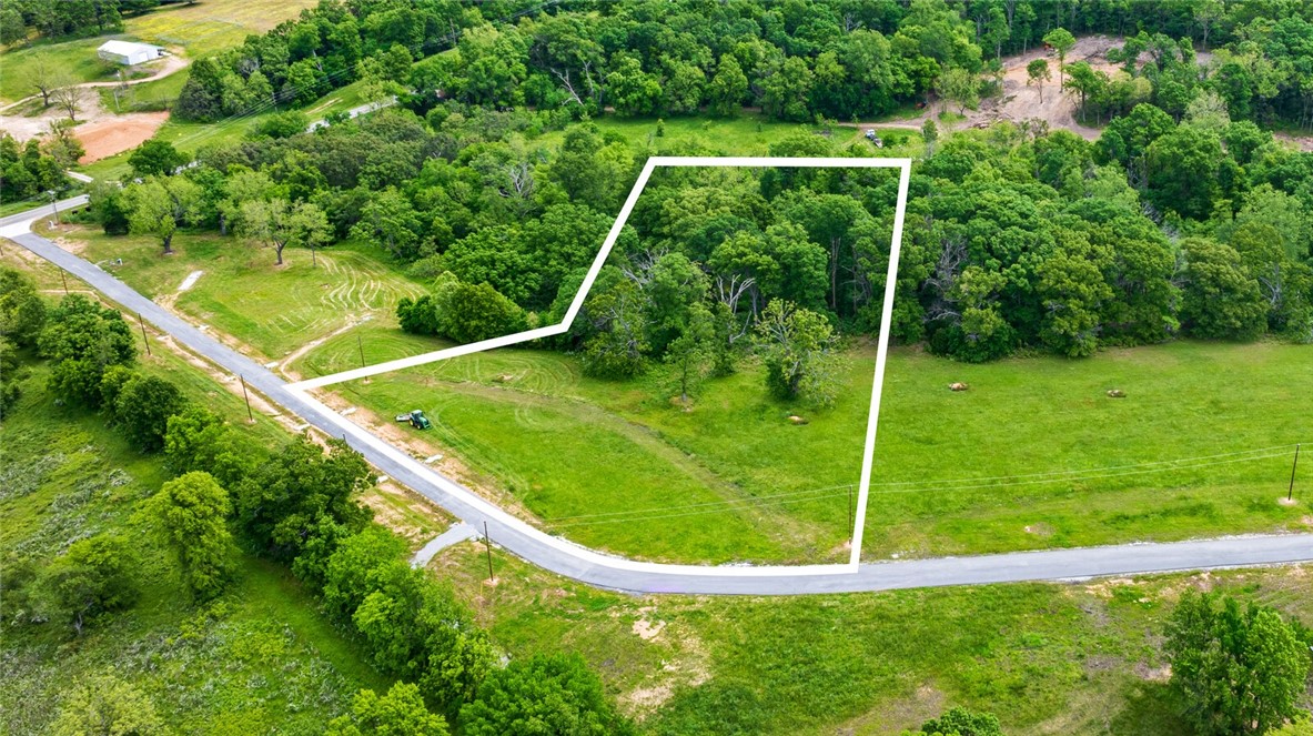 Introducing Hill Country Estates, a new subdivision offering private, idyllic estate size lots! Located off a quiet, winding drive leading to nature, solitude and beauty amidst rolling wooded terrain. The individual lots are 3+ acres estate lots, gently sloping and partially wooded, providing a perfect mix of privacy and accessibility, while being close to town and less than 20 minutes to downtown Bentonville. This tranquil subdivision requires single family residence with a minimum 3,000 square feet heated/cooled living space.