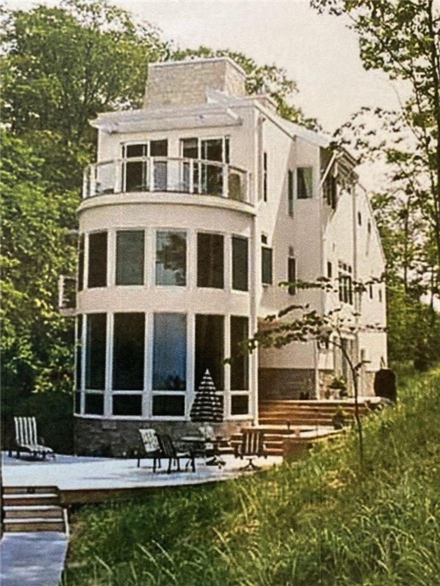 Construction ready nautical themed home steps away from Beaver Lake. Located close to Rogers, AR, one mile east of Highway 12 bridge. This three level home will feature an elevator from from the first level garage, entry and studio area to second level twin master suites, third level kitchen, dining, entertaining and additional guest bath, with elevator stop at fourth level widows nest observation area. The home will include rooftop solar with battery backup, heat pump with propane backup supplied by 1000 gallons of on site underground storage, and private well. Minimalist full overlay frameless European cabinetry topped with 3 centimeter granite will provide a clean modern look that is also functional and warm. Hard surface flooring throughout makes this home beautiful and easy to maintain as well as pet friendly. Beautiful lake views from master and third level deck. Dock permit applied for. Accessible, bright, efficient, in a stunning location. Put your own touches on this great idea.