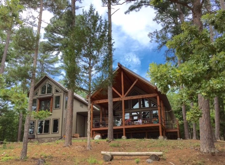 Make this incredible Beaver Lakefront home yours.  This custom built one owner lake home is only 2 yrs old.  Kitchen contains stainless steel appliances and quartz counter tops.  Range is on propane and has a water faucet for filling pots.  Den has large windows for your lakeview and a wood burning fp with gas starter. Bonus room that can be used as second living area, playroom or bunkroom. Home comes with 1 boat slip, 12x30, and lift in community dock.  Dock has a swim platform and is solar powered.