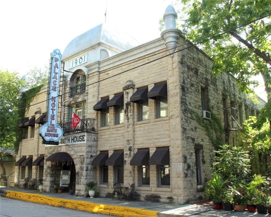 Don't miss the opportunity to own a widely known, one of a kind historic architectural icon in Eureka Springs, famous not only for the rich detailing of hand hewn split face limestone and grand arched entrance, but also the jumbo scaled neon sign.  Step off the street to the magnificent, historic lobby.  The hotel features eight luxuriously elegant, yet sumptuously comfortable and very spacious King Jacuzzi suites, four on ground level, and four on upper level.  Downstairs from lobby on the lower level is the iconic Bath House Spa, which preserves the classic elegance and ambiance of the original Bath House. Guests also enjoy the gazebo and patio garden for weddings and special events.  Terrific opportunities for capitalizing on package bookings. Roof and nearly all windows replaced in recent years.  Begin earning income immediately! Financials subject to Seller Approved Proof of Funds letter. Proposals subject to Seller's Attorney approval (Seller's Option).