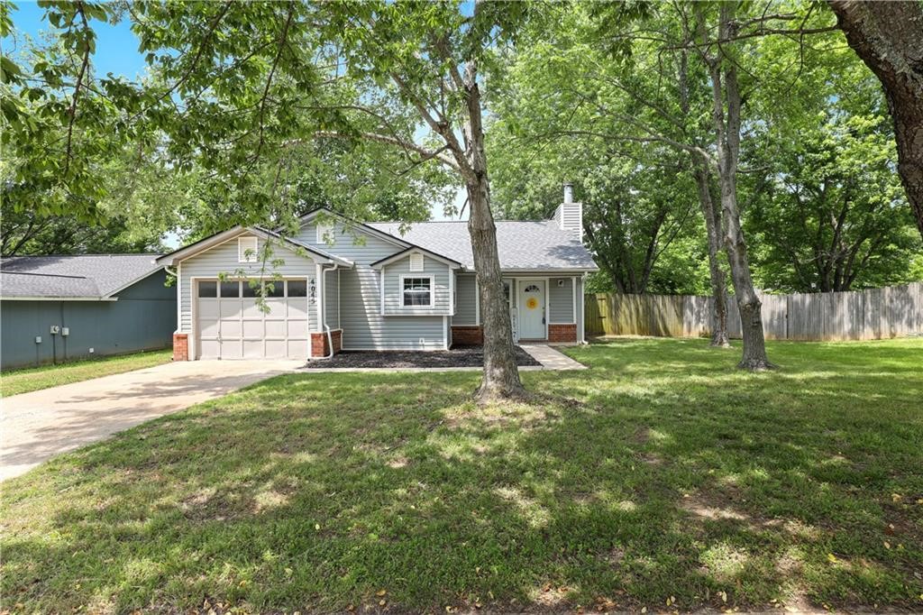 This fabulous Fayetteville home is a rare gem located in the IDEAL location. Located on a quiet well maintained cul-de-sac just a half mile from Paradise Valley Golf Course. This cottage cutie features new modern siding (2022), new gutters (2022), new roof (2021), New Water Heater July 2023, new garbage disposal (2023), new toilets (2023) a beautiful new pristine master bath/shower remodel (2023) and vinyl windows. Private and fully fenced backyard with covered patio with extended native stone area. Hard surface flooring throughout the home—no carpet. Gorgeous gas fireplace in the living room that flows out to a peaceful fenced-in patio/backyard. Prime location in uptown Fayetteville minutes from trails, parks, Fayetteville Botanical Gardens, Lake Fayetteville and uptown amenities/restaurants. Less than 15 minutes to University of Ark. Agent owned.