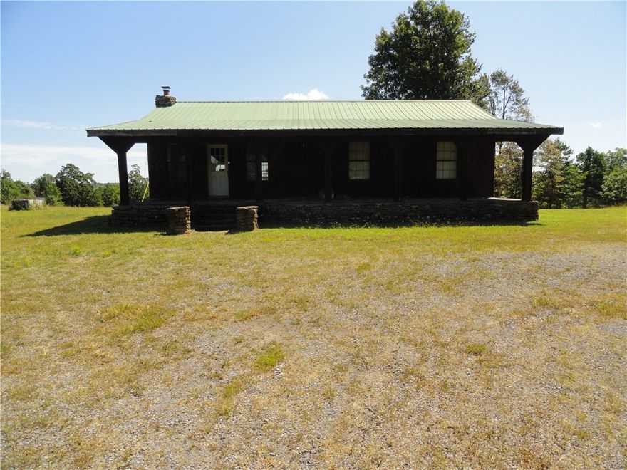 Rustic charm meets modern comfort in this 3 bed, 2 bath home with a view on 36 secluded acres. Features include wood siding, metal roof, real wood floors, central heat/air plus an Ozark Brand real wood stove to warm the whole house on cold winter nights and lower winter heat bills. Large covered front porch and spacious covered back porch with sunset views. Washer, dryer, fridge, cook stove, dishwasher, and wood stove all convey. Private well water now or city water hookup is available. The property also features three ponds and nearly full perimeter fencing. 2 extra rural water meters along the county road allows for possible subdividing for relatives. Fruit trees grow inside a separate fenced dog run and fiber optic internet for working from home. Not far from endless outdoor activities such as camping, fishing, swimming, boating, horseback riding and hunting. 90 minutes from Branson, MO, 40 minutes from Greers Ferry Lake & 30 mins from Mountain View, AR—a popular vacation spot near Blanchard Springs Caverns.