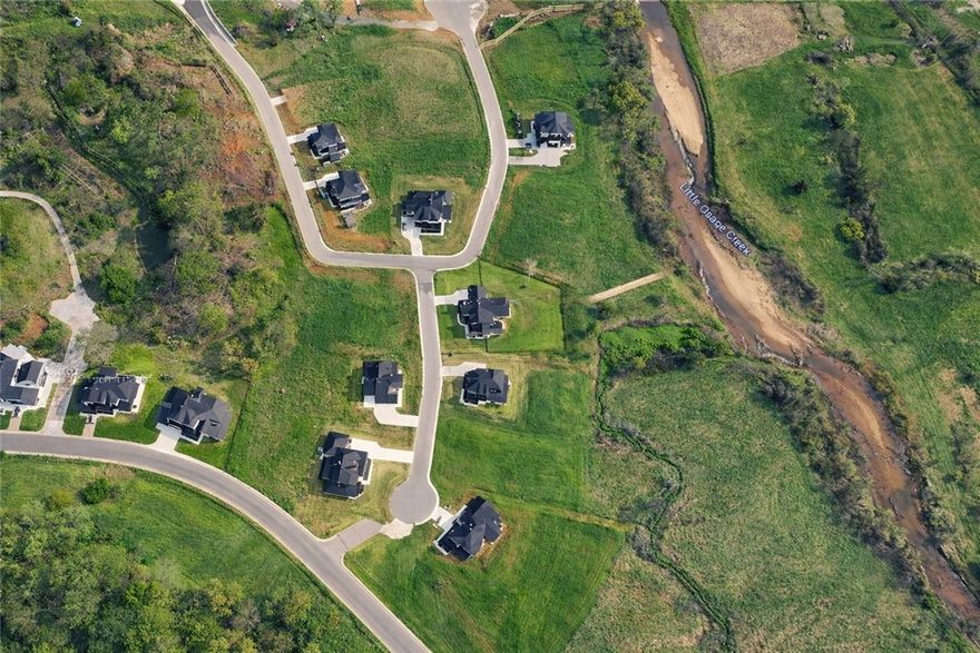 Discover the perfect blend of space and serenity with this nearly 2-acre homesite situated along tranquil Osage Creek in the highly sought after Healing Springs Subdivision. Flat lot offers scenic views and room to build your a beautiful home.