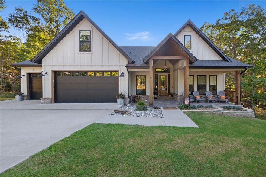 This beautiful, 2023-built home is nestled on a large relatively flat lot in Bella Vista. The thoughtfully designed open-concept layout features 2 bedrooms on the main level. A spacious bonus room upstairs is complete with an en-suite bathroom and closet—perfect for a media room, guest suite, or office. Natural finishes throughout include solid wood cabinetry, cedar beams in the entry, and ceiling beams in the vaulted living room. The screened-in, covered back patio provides a peaceful space to relax or entertain while taking in the wooded views. The primary suite enjoys private access to the patio and boasts an en-suite bathroom with a large walk-in shower/soaking tub combination. An oversized 6 bay garage with epoxy floors, 8-foot doors, and 28-foot depth provides exceptional space for vehicles or storage. Additional features include 2x6 constructed walls, pre-installed holiday lighting, and a 10x12 shed with electricity. A wonderful opportunity to own a newly built home that balances craftsmanship and privacy.