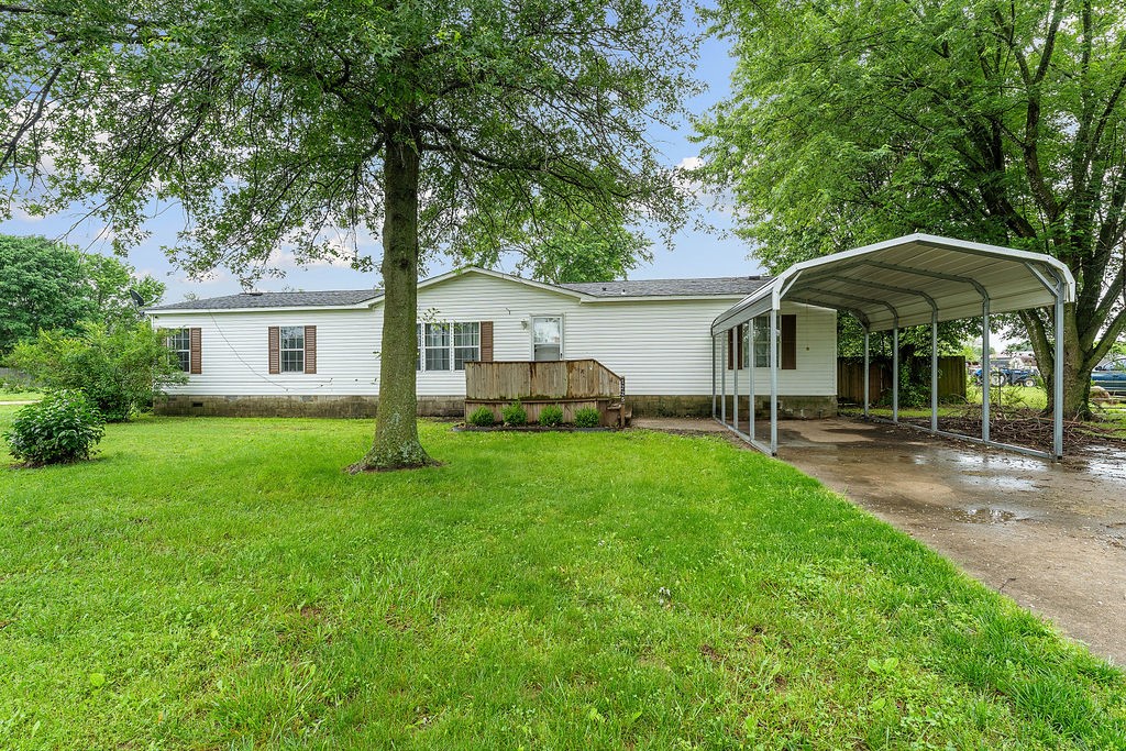 Welcome to this wonderful home with an amazing backyard retreat. Sitting on roughly .75 acres, this home offers lots of backyard space to make it your own and is completely fenced in. Let's not forget the home is 1,690 sq ft of open space. Some of the features worth mentioning are the large windows in the living room to allow natural light in. The living room flows into the dining room, which features a beautiful sliding glass door that provides access to the back deck to enjoy the warm summer evenings. The primary bedroom is one of the biggest rooms in the home; it has enough space to nicely hold a king-size bed, and it also features a walk-in closet. Don't forget to check out the Primary bathroom, featuring a large bathtub, walk-in shower, and double sinks! This home is all about storage space, the kitchen offers a large island with extra storage. The kitchen offers lots of natural light, along with an abundance of counter space, giving you the room you need to cook whatever is on the menu!
