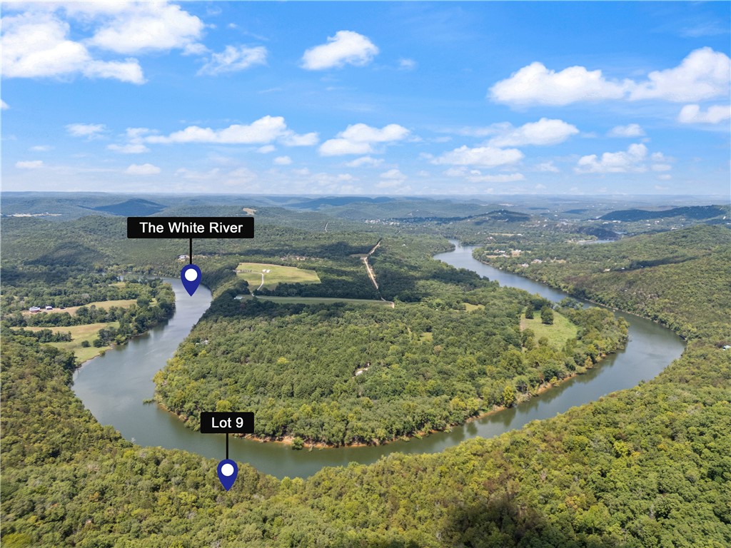 Large private wooded acreage overlooking the White River. Located only a couple miles from the new Opera of the Ozarks. Just minutes from beautiful downtown Eureka Springs. Trout Fish on the White River, enjoy Beaver and Table Rock Lakes, all just minutes from the property.