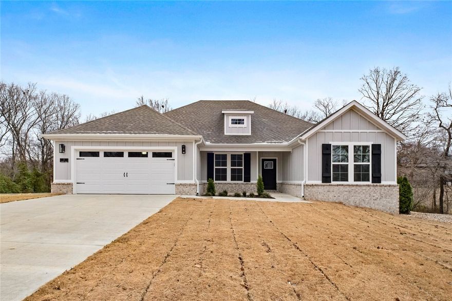 This one is a must see! Beautiful new construction home on a generous .35 acre CORNER lot! Perfectly situated just minutes from Lake Loch Lomond, Highlands Golf Course, Branchwood Community Center, and provides quick access to I-49, this property offers both convenience and access to nature. Inside, you’ll find a well-planned split floor design with 3 Beds + Office, 2 bathrooms and elegant finishes throughout. The open living space highlights vaulted ceilings with striking beams that add warmth and character. The kitchen is designed with quartz countertops, a gas range, custom cabinetry, and sleek black stainless appliances. The primary suite is a relaxing escape, featuring a spacious walk-in closet, a custom tiled shower, and soaking tub. Step outside to enjoy the covered deck, ideal for unwinding or entertaining. Ask your agent about the builder’s preferred lender credit.