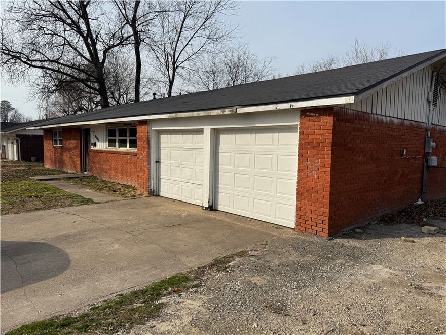 FIXER UPPER.  Financing to be Conventional or Cash only as property is selling "AS IS, WHERE IS. No Property Disclosure as owner has deceased. All offers need to state: Subject to approval of Probate Court of Washington County, Arkansas, and have proof of funds attached. Bedroom#3 & Den along with 2nd kitchen would make a great mother-in-law apartment or area for teenagers.