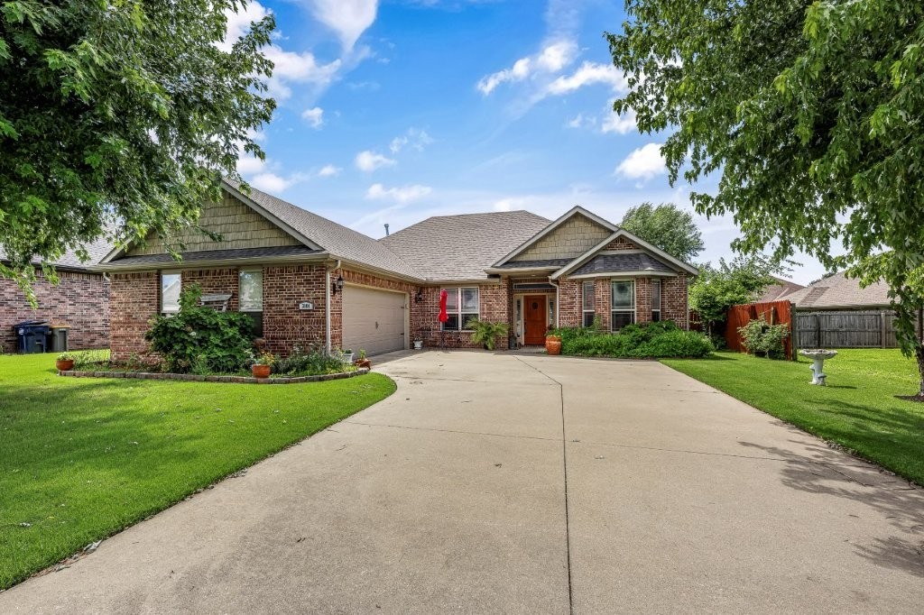 100% all brick home in a fabulous location (Rogers) sitting on a pristine lot in an established neighborhood. Popular open concept & split bedroom floorplan is perfect for entertaining. Living area hosts a full brick gas log fireplace & trey ceiling with loads of crown molding. Kitchen with breakfast nook has granite countertops, custom cabinets, SS appliances including a gas range. Spacious Primary Suite features trey ceiling, bath with dual vanities, custom tile shower, jetted tub & walk-in closet. Covered Patio overlooks lush landscaping & privacy fenced back yard. Enjoy lower utilities using the newer Solar Panels. Excellent curb appeal with a side load garage & flat driveway! Just a few mins to NWACC, I-49, downtown Rogers or downtown Bentonville & the new Walmart Headquarters! Come see today!