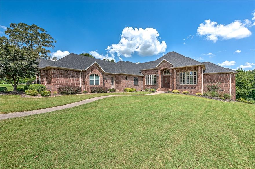 Welcome to this elegant single-level home with beautiful tall windows that accent this landscaped 3.8 AC lot in Talamore Subdivision. Enjoy a large island kitchen w/ newer appliances, walk-in pantry and walk-in wine cooler. Each bedroom with its own full bath. Private backyard with large entertaining deck with views and saltwater pool. Property is 15 minutes to Walmart Headquarters.