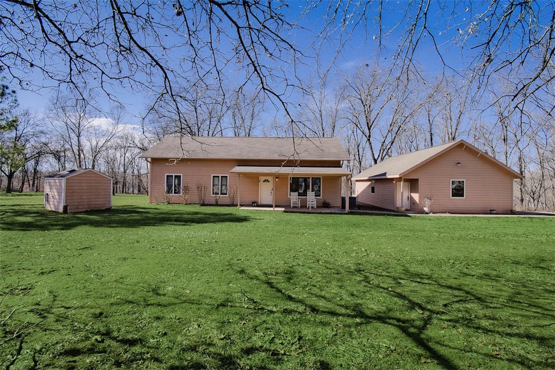 Discover your private sanctuary on 10.62 acres of breathtaking land. This exceptional 4-bedroom, 2-bathroom home, boasting 2837 sq ft, features hand-scraped hardwood floors, a nice and functional kitchen with solid surface countertops, a range with double oven, and an open floor plan designed for effortless living. Abundant natural light streams through solid wood windows, creating a warm and inviting atmosphere. The oversized outdoor patio and a dedicated mudroom enhances the home's functionality. Property has a large detached 3-car garage and for the equestrian enthusiast, a fully equipped 4-stall barn with tack and feed rooms, a hay loft, with accessible to drive a trailer directly to the barn and don't miss the arena, there is water to the barn and at the arena. All this situated at the end of a very private road, this property offers unparalleled seclusion and tranquility.