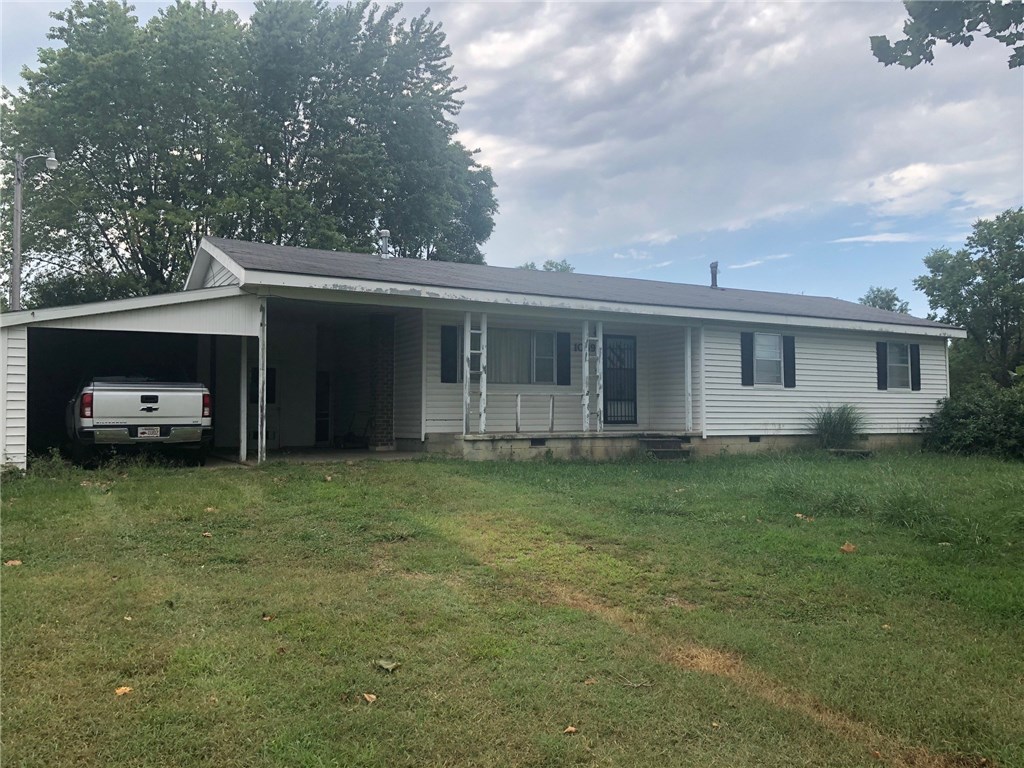 Older farm home on approximately 1 acre just outside Fayetteville city limits. Desirable location with good views to the east.