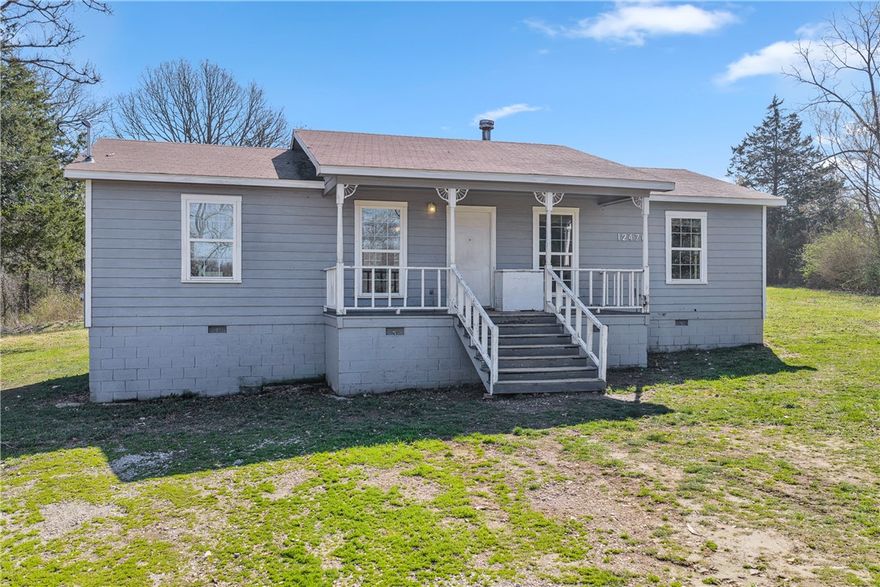 Opportunity is knocking on Fire Run Road! Sitting on just under an acre of cleared, level ground near Hwy 62 in the heart of the Avoca area, this 3-bedroom, 2-bath home is priced to reflect its condition and the incredible potential it offers. Whether you're an investor, a handy buyer ready to roll up your sleeves, or someone looking for the perfect lot to build your dream home, this property checks the box. The 1,152 sq ft layout features a split floor plan, wood-burning fireplace, and a covered porch — solid bones with the right vision. Taxes are an unbelievably low $732/year, and the nearly one-acre lot gives you room to dream big. Conventional or cash financing recommended. Properties like this — affordable land in a great location — don't last long in NW Arkansas. Come see the possibilities!