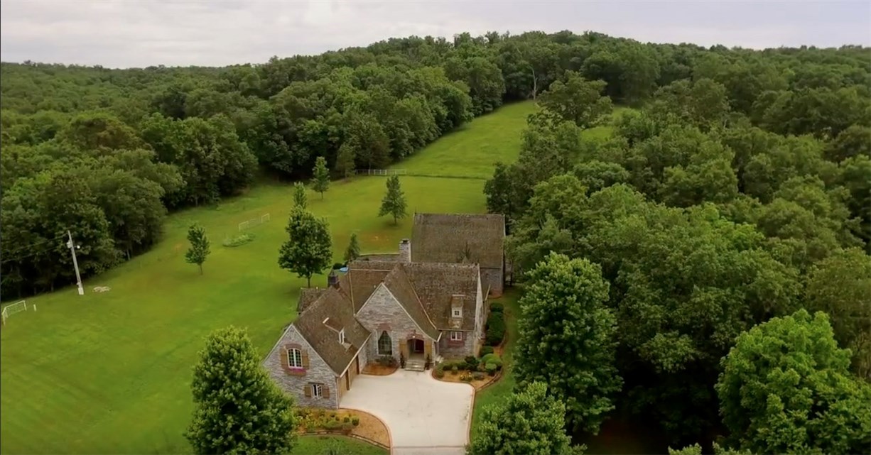 BREATHTAKING 45 Acre ranch (80% pasture) w/stocked pond. BEAUTIFUL 3000SF, 3BR 2.5BA PLUS a 1200SF w/1 FB guest house (total of 4200 SF H/C). Attached 2 Car Garage. (SEE RES MLS 1048606.) 2016 BLT 40x60 four stall barn (w/water & electric) tack room, loft & office side storage. Frontage to spring fed COON CREEK.
