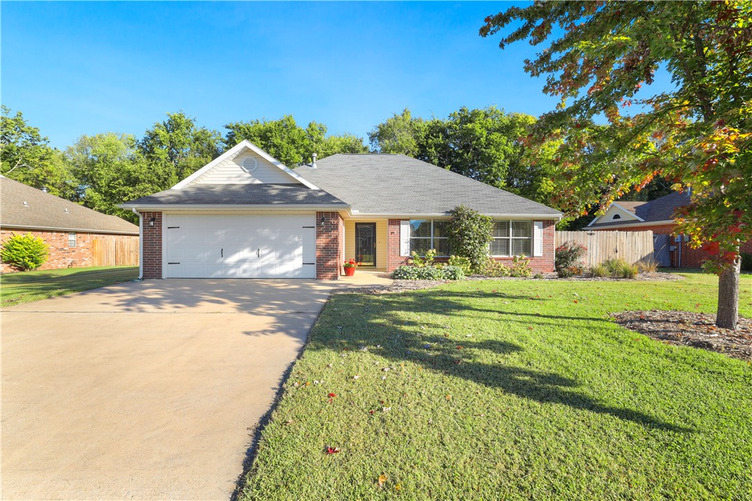 IMMACULATELY MAINTAINED. Discover this amazing 3-bedroom, 2-bathroom residence with a roomy living area, formal dining room, and a generously sized fenced backyard. Recent updates include fresh landscaping, new paint, and freshly stained kitchen cabinets — Unwind on the inviting covered patio! Have all the cook outs here :) Situated in a peaceful neighborhood, this home has easy connectivity to Hwy 49 and is only a 9-minute drive to the University of Arkansas.