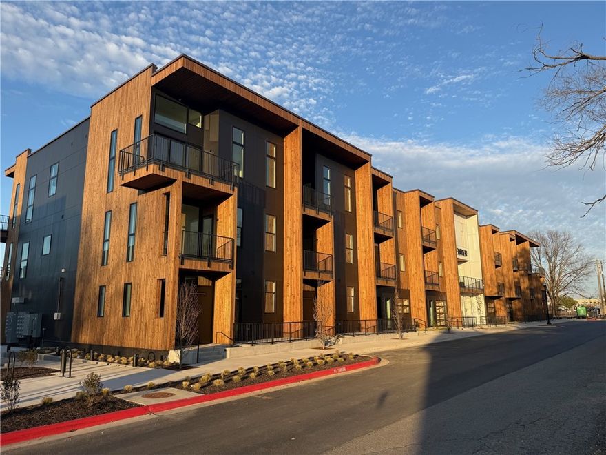 Welcome to The Haven Bentonville, a collection of 29 architecturally elevated condominiums perfectly positioned between the Downtown Square and the Walmart Home Office campus. This residence, known as the De Kooning Loft, draws inspiration from bold modern design and exceptional natural light. The home features one of the community’s most impressive kitchens, opening to a spacious living area anchored by a dramatic steel staircase that rises sculpturally into a two-story open loft. Two outdoor decks enhance the experience—one off the main living space and a private deck off the primary suite—offering views toward The Momentary and the campus. The kitchen is equipped with European-designed Bosch appliances, including an induction range and counter-depth refrigerator, granite waterfall island, and wide-plank hardwood floors throughout. The Haven offers secured access, elevator service, and an elegant lobby—an exceptional piece of modern architecture in the heart of Bentonville. Also comes with a private garage.