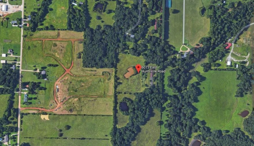 Perfect location for development near Fayetteville! 4 ponds, home from 1958 with 5 car garage. Frontage on 16 E in Baldwin. 1st time on market in 60 years!