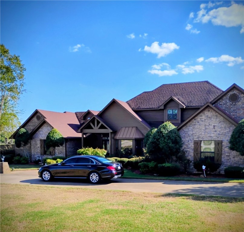 Incredible custom built home crafted with quality throughout. One level except for game room above garage. Tremendous estate nestled on 3 acres close to town. Large 30 x 30 detached shop with 2 garage doors in front and a third door in the rear to drive thru. Beautiful cooks kitchen overlooking the den. Large breakfast bar. Extremely well cared for and maintained. Quality cabinetry and built-ins throughout the home. Stamped concrete floors in hallway and bedrooms engineered wood floor in living and dining. Impressive stack stone fireplace, roof new in 2017, new microwave, camera and security system, newer hvac units, new disposal, extremely energy efficient. Must see this home to fully appreciate.