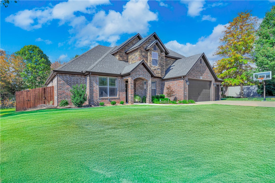 Welcome home to Wildflower Meadows in west Fayetteville. Lovely, well-maintained 4 bd/2.5 bath house with highly sought after first floor primary suite, 3-car garage and heated saltwater pool. The living area opens to a gourmet kitchen with island and breakfast area. Spacious primary suite has a large walk-in closet, jetted tub and separate shower. An office, dining room, guest bath and laundry room complete the first floor. Upstairs has 3 large bedrooms, all with walk-in closets and a full bath. Granite counter tops throughout. Multiple upgrades too numerous to mention include new dishwasher, gas cooktop, carpet and garbage disposal. Enjoy the private backyard with pool and covered back porch. Ozarks Electric energy audit and new energy-efficient attic air exhaust system. Just minutes from I49 and the Clabber Creek Trail.