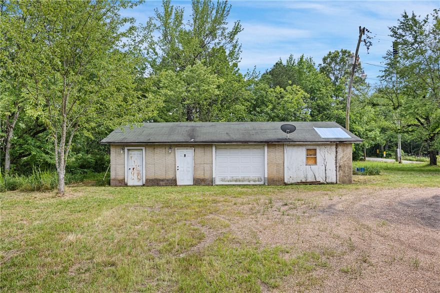 If you're looking for a solid commercial space with room to grow, check out this property at 10001 Alpha Road in Dardanelle. Sitting on just under an acre, this 1,056 square foot building was previously used as a car lot and is built with poured concrete forms—sturdy and low maintenance. The electrical has been completely updated, so you're starting fresh. The property has an active well, and city water is available at the street if you prefer to hook in. Plenty of room outside for parking, displays, or whatever your business needs. At $125,000, it’s a great spot with tons of potential and flexibility for your next venture.