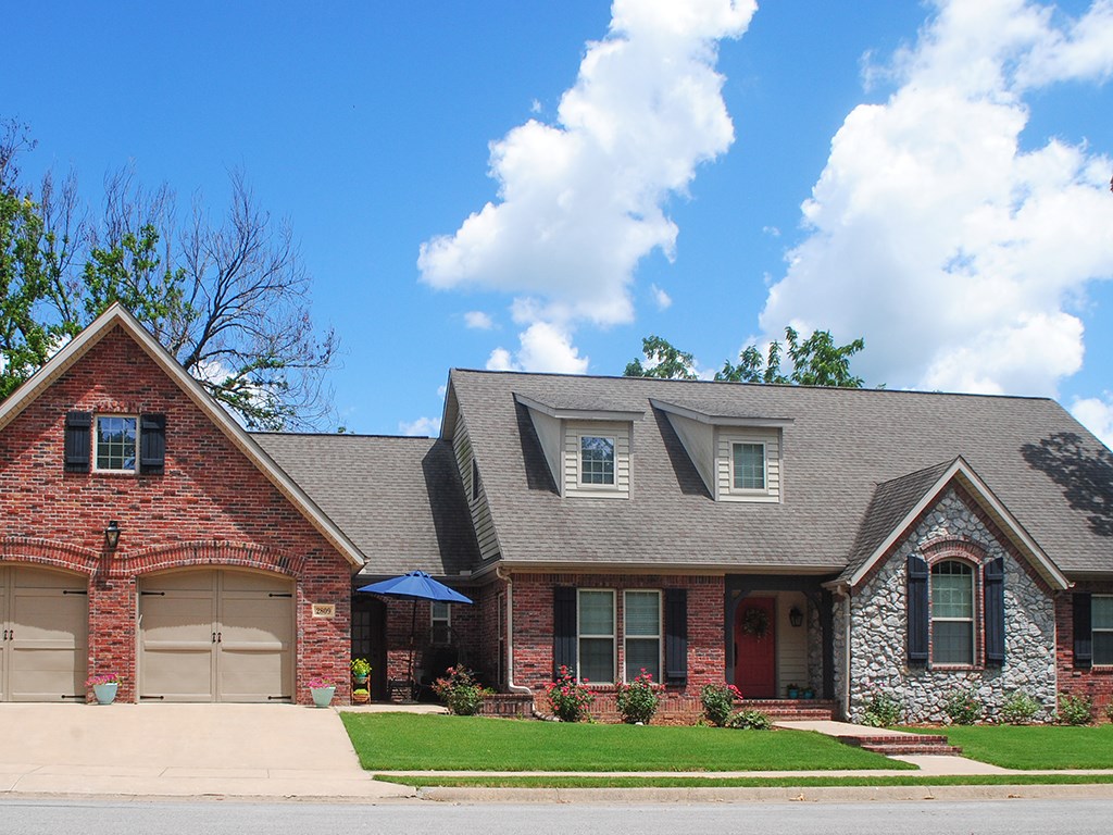 This beautiful home on a quiet street features split-floor plan & upgrades galore: premium kitchen cabinets w/pullouts, granite counters, blinds, crown moulding, ADT security system, custom built-ins
& more. Main level features formal dining room w/ butler's pantry, eat-in kitchen opening to family room, homeowner's room w/en suite bath, double sinks, jacuzzi tub, shower & walk-in closet. A front bedroom can also be used as an office, includes closets & built-in window seat. Two additional bedrooms, a full & half bath, mudroom/laundry room complete the 1st floor. Upstairs is a 950 sqft bedroom/bonus room +full bath w/ dedicated HW heater & AC unit. A second small patio in front is the perfect place to enjoy your morning coffee & hear the wind blow through the trees. Large two-car garage features space for a workbench. Attic access is available in both the bonus room & the garage (with built-in ladder). Dual AC systems have smartphone programmable app that lets you monitor & adjust the temperature remotely.