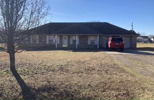 This three bedroom two bath home with a split floor plan and large lot is a must see! The home features a large storage room right off of the two car garage. This beautiful home has a welcoming front and the back porch is covered and perfect for grilling and spending time with family.