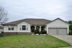 Beautiful 4-bedroom 3-bath home right off the golf course. Upstairs has new high-end vinyl plank flooring in the office, living room, and dining room, as well as new lighting throughout. Spacious living room has built in surround sound and gas fireplace. The kitchen has nice new dishwasher and stove and a spacious breakfast nook. The double door master suite is spacious with large master bathroom and walk in closet. Well maintained back yard with new composite decking and a large covered concrete patio off the basement garage. This house is fitted with a video surveillance system, and built in alarm to keep you and your family safe. This house is a must see!!! Don't miss this updated family home in the beautiful golf course area.