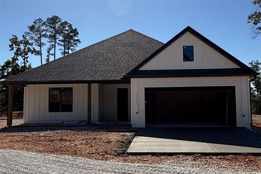 If you’re looking for a place to start making memories that’ll last a lifetime, this is a great place to land! Bonus points for being a new construction home sitting on 5 beautiful acres & of course, there’s already a shop.  If you aren’t calling your lender & have a time set to see this one, you better get busy so you don’t miss out. Inside you’ll find 4 bedrooms & 2.5 bathrooms, a large open living area with lots of windows to see the gorgeous views. You will have room to bake dozens of cookies in the oversized kitchen, featuring an island for extra work space, room for stools to sit around plus a dining area. The home has LVP flooring for beauty and durability, Quartz counters to showcase your exceptional space & stainless appliances to pull it altogether. Inviting, neutral paint throughout for any style you choose to decorate your new space. This dream is located near Beaver Lake & just down from Hobbs State park. A great location for any outdoors enthusiast, yet not far to the developing downtown of Rogers.