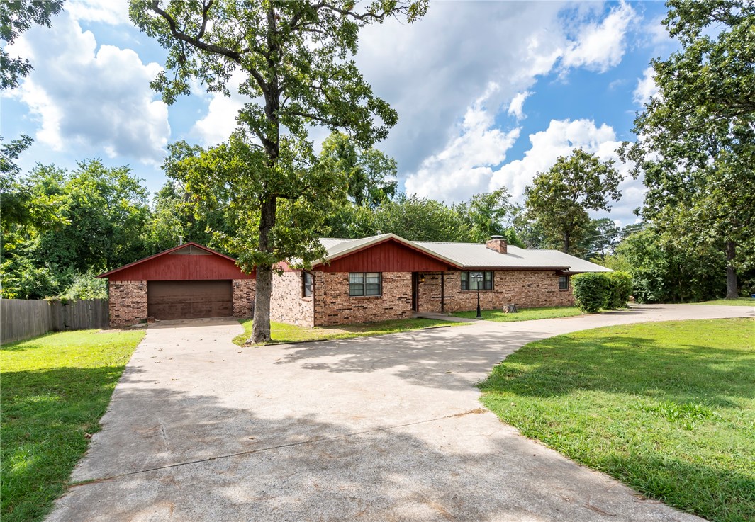 Charming brick home with spacious brick workshop. This inviting 3-bedroom, 2-bath home is located at the entrance of the desirable Country Acres neighborhood. Beside the home sits a 37' x 29' workshop complete with its own HVAC system. Inside, the kitchen features a gas range, dishwasher, and microwave ā all just 3 months old. A bright sunroom offers many options. (Cute she-shed does not convey).