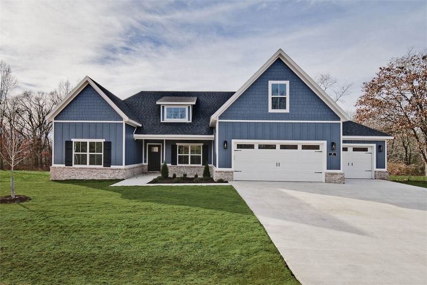 Check out this stunning new construction home on a FLAT .54-acre wooded lot! 3 car oversized garage! With 4 bedrooms and a bonus room complete with a full bath, there's plenty of space for everyone. The vaulted living room features beautiful beams and elegant wood floors, adding to the home's charm. The kitchen showcases a waterfall island, custom cabinets, premium black stainless steel appliances, a gas range, and 3 cm quartz countertops. Retreat to the primary bath, which offers a luxurious large walk-in tile shower, a free-standing tub, and generous closet space. Huge covered back patio! Quick access to I-49, Lake Loch Lomond, Highlands Golf Course, and Branchwood Recreation Complex and Nature Trail. This home perfectly balances tranquility and accessibility. Plus, take advantage of $3,500 in buyers closing costs, courtesy of the builder's preferred lender!