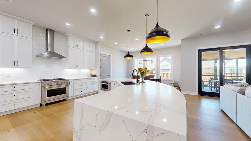 Where luxury meets sophistication in the prestigious Aurora Horizon Neighborhood. You are greeted by the allure of an open floor plan, adorned with wood floors that exude warmth & elegance. Indulge your culinary desires in the envy-worthy kitchen, equipped with GE Café Appliances, a stunning waterfall quartz island that beckons for gatherings & a walk-in pantry with outlets & waterline for 2nd fridge. The luxurious primary suite is a retreat unto itself, featuring plantation shutters, closets with outlets, & a sprawling spa-like primary bath boasts a soaking tub & walk-in shower. Upstairs offers 3 bedrooms with walk-in closets, 2 full baths, & a 2nd living area with remote blinds. Enjoy outdoor living on the screened-in patio with a gas line for grilling & entertaining. The 3-car sideload garage features an epoxy floor. Convenience & functionality are seamlessly integrated into every aspect of this remarkable residence. Don't miss your chance to call this extraordinary property home & elevate your lifestyle!