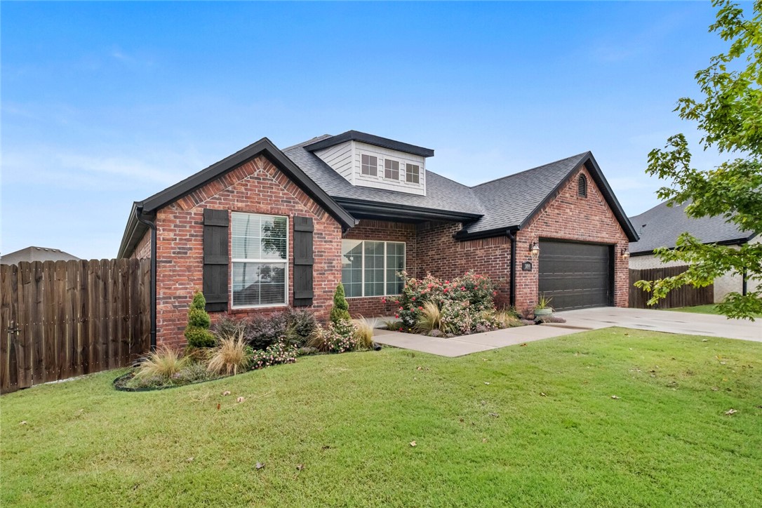 Do not miss the opportunity to call this spacious 4-bedroom, 2-bathroom home yours! Tucked at the end of a cul-de-sac on the largest lot in the neighborhood, this property features a fully enclosed backyard perfect for play, pets, or entertaining, plus an extended patio designed for gatherings. Inside, you will love the open living space with flexible secondary bedrooms, including one that works perfectly as a home office. The kitchen offers two dining areas, additional island seating, and a beautiful white apron sink. The primary suite boasts vaulted ceilings, a large bathroom, and a walk-in closet for plenty of storage. Just across from Shaw Family Park, you will enjoy walking trails, splash pads, playgrounds, and more. The HOA includes access to a neighborhood pool for fun and relaxation. With its central location and easy access to I-49, commuting anywhere in Northwest Arkansas is a breeze. Do not wait to book your showing for this home that blends space, convenience, and lifestyle in one incredible package!
