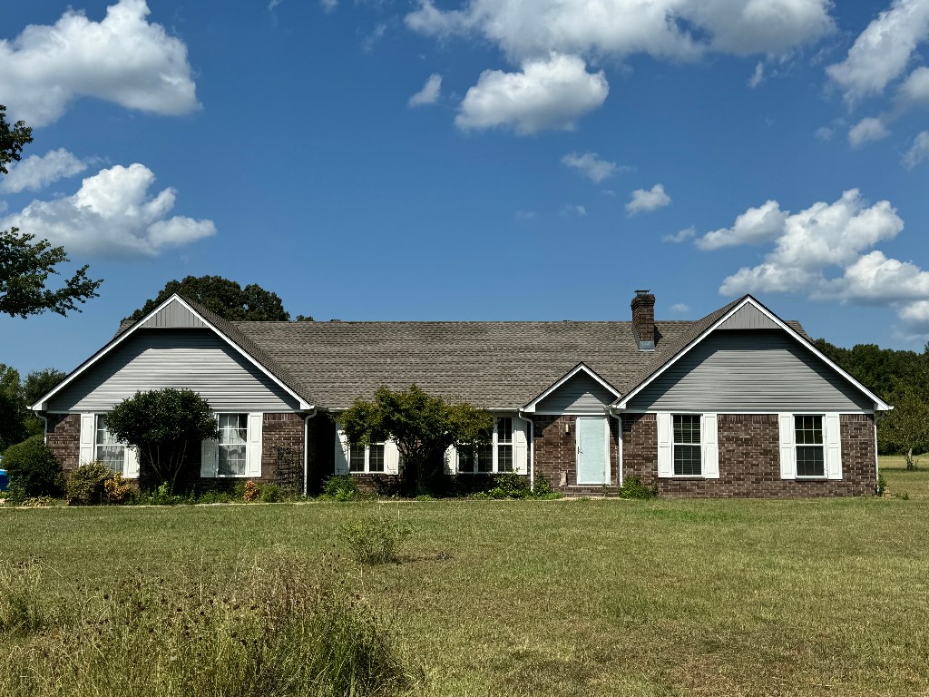 Wonderful updated home on 10+ acres_new roof, new siding, new kitchen countertops, new tile & ceiling fixtures in rooms and dining along w/ the majority of the house freshly painted. There is a separate shop (approx. 1,200 sq. ft.) with a concrete slab floor to be used as a workshop, additional vehicle storage, ATV storage, etc. Enjoy the fireplace in the open floor plan living area/kitchen. Additional acreage allows you to bring your larger furry friends or land can be subdivided to build another home.