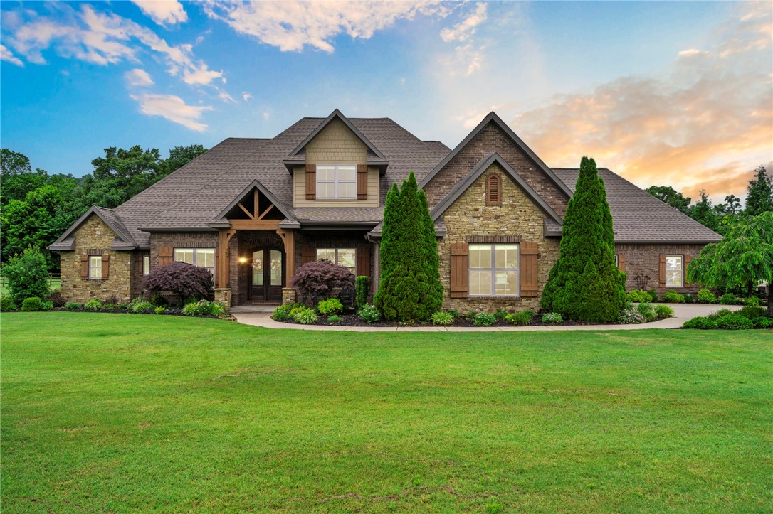 Welcome to your own private retreat—where luxury meets comfort on over 2 secluded acres. This custom-built home offers 5 bedrooms, multiple living areas, & is designed to invite both entertaining & day-to-day living. Inside, rich hardwood floors carry throughout the main level. The Formal Dining Rm is ready for hosting, while the private Office provides a quiet space to work. The heart of the home is a Chef’s Kitchen- complete w/custom cabinetry, a cozy adjoining Hearth & eat-in area—creating the perfect flow for casual mornings or gatherings. The covered Patio, with its full outdoor Kitchen invites weekend cookouts & peaceful evenings under the stars. The Primary suite offers a true escape, while each additional Bedrm features its own en-suite Bath—ideal for guests, multi-generational living, or growing families. Beautifully landscaped & well maintained, this home also includes an attached shop—perfect for storage or extra workspace. Located just minutes from town yet perfectly tucked away, this is a must see!