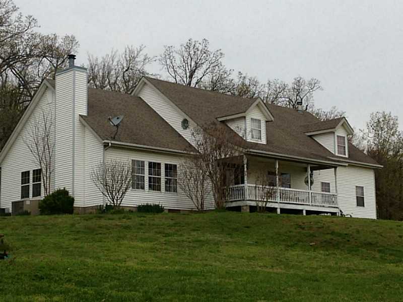 Large home and workshop on nearly 43 Acres. Home has some updates such as wood flooring, Kitchen has stainless appliances, newer fixtures, and recessed lighting. Workshop is 60 x 40 and is only a few years old. Home to be sold "As Is Where Is.",Property also has a couple of older workshops, barns, or storage buildings. Large 4th bedroom over garage could be bonus room.