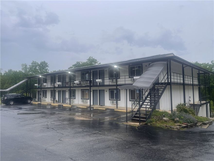 Exceptional Investment Opportunity in Holiday Island, AR
Unlock the potential of this commercial property offering multiple income streams. Located in a growing resort community, it includes two major features:
1. Hotel-to-Multifamily Conversion: A 10,500 sq.ft. building, originally a 30-room hotel, is being transformed into 24 studio and 1-bedroom units, with 11 already completed and rented. Ideal for short or long-term rental income.
2. Turnkey Restaurant & Bar: A 4,338 sq.ft. fully equipped restaurant with a commercial kitchen, dining area, and bar. It includes an 832 sq.ft. outdoor deck for events or expanded seating.
Above the restaurant is a 2-bedroom, 1-bath apartment for owner use or additional rental income. Both buildings are on a single tax parcel, simplifying management. This property offers incredible versatility and upside in a thriving destination.