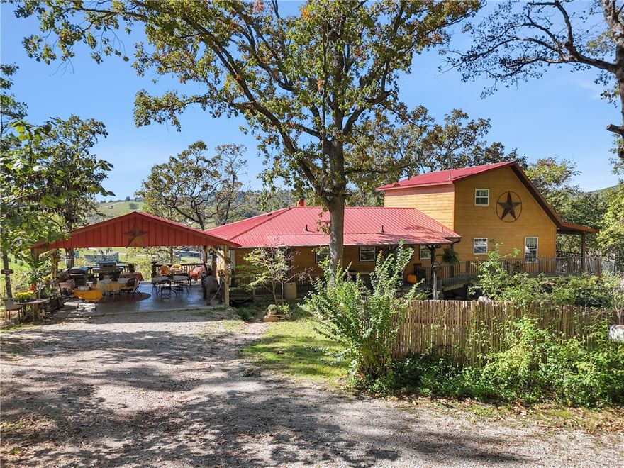 Stunning Riverfront property just on the cusp of Eureka Springs!  Over 3500 sq.ft. of gorgeous living space and sits on 3.67 unrestricted acres, with private access to King's River. Newly remodeled addition which includes two kitchens on main floor. Third floor loft also part of remodel. Finished basement with indoor storage, creates another living room or another beautiful bedroom and walk out access to gardens, and the river. New roof in 2017. Upgrades include ON-Demand Hot Water Heater, 3 new heat pumps, and complement Central heat/air system.  30x50 Insulated Outbuilding with garage, designed for storage.  Log Cabin 'Ozark Mountain Hideout' with historic artifacts.  The Dream Weaver Air Stream with hot tub. A Western Theme Saloon! Metal Building equipped with props and sliding barn doors.  Alfresco dining pergola! This resort property can be run as nightly rentals or take in all the beauty yourself! Walking trails and stairs lead to the river's edge.  Minutes to Eureka Springs! Less than an hour to Branson!