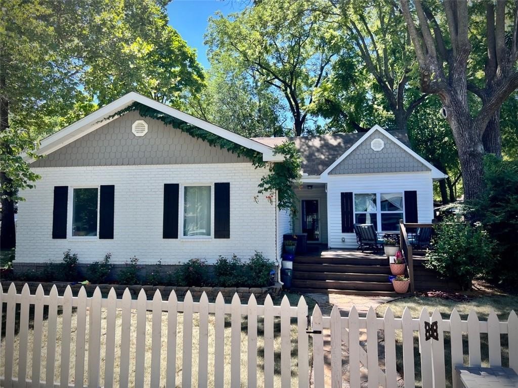 Charming, fully renovated home on a corner lot in downtown Rogers! Just minutes from shops, restaurants, coffee spots, and cocktail bars. Enjoy outdoor activities with nearby biking and mountain biking trails, plus the Railyard Bike Park. The home features an open concept with a second living area, a spacious primary suite with a walk-in closet, dual vanities, soaker tub, and walk-in shower. Modern amenities include a mudroom, home office, two storage rooms, large front deck, and backyard patio perfect for entertaining. ** $250 non-refundable pet fee per pet.**