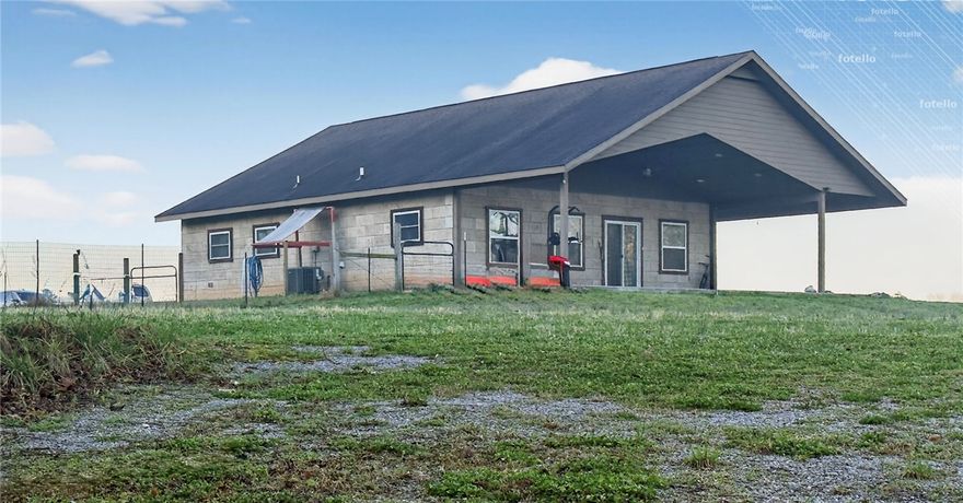 Illinois River Access. Rare opportunity on 4 scenic acres along the Illinois River with direct access—perfect for outdoor enthusiasts or entrepreneurs. This well-maintained 3 bed, 2 bath home offers a comfortable, open layout ideal for everyday living or short-term rental use. An upstairs bonus room provides flexible space for a home office, media room, guest area, or additional living space. Enjoy peaceful views from the spacious covered front porch overlooking the natural surroundings. The property’s river frontage creates potential for a canoe/kayak rental business or private retreat. A 30x30 shop provides excellent space for equipment, storage, or workspace. Solar panels help keep energy costs low, averaging around $25/month. Whether you're seeking a full-time residence, Airbnb investment, or income-producing river property, this one delivers. (Current Monthly Lease Income - $2,500)