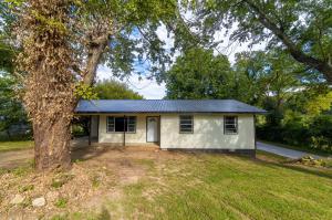 Nicely remodeled 3 bedroom, 1 1/2 bath home conveniently located near downtown Harrison and NorthArk College. Updates include a new metal roof, new CH&A, updated plumbing, freshly painted inside and out, all new floor coverings, light fixtures, kitchen and bath hardware, and countertops including unique epoxy countertops in the baths. The back deck has been completely redone. The tall crawl space allows for extra storage. Move in ready and NorthArk's disc golf course is your neighbor!