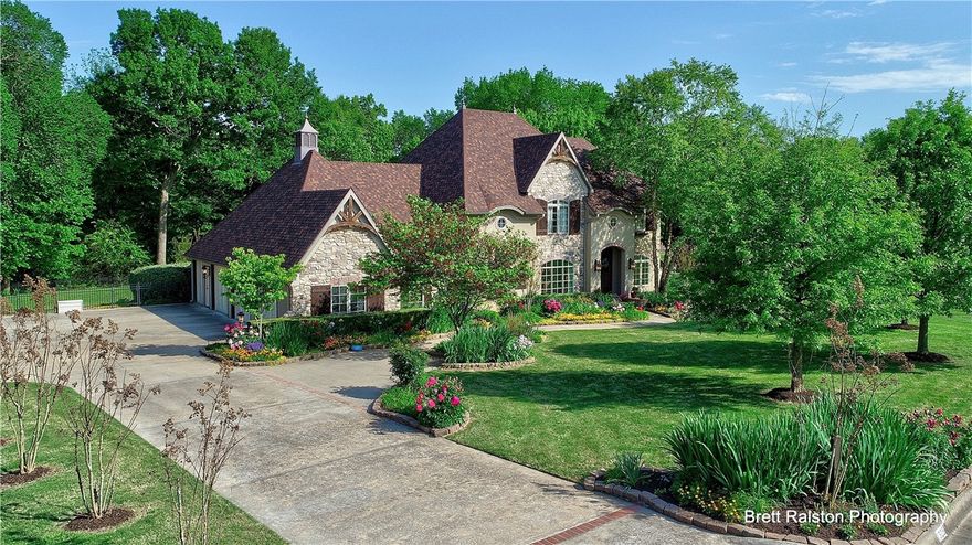 This stunning home welcomes you with beautiful landscaping & a stately exterior.  Pristine interior is warm & welcoming featuring office, FDR, LR w/FP, gourmet kitchen w/4cm granite, den w/FP & MBR on main level.  Lots of windows!  Brazilian cherry hwd floors.  Second level features 3 BR, media room w/in-wall speakers & kitchenette.  There are 2 temp controlled wine storage rooms for approx 3100 bottles.  Luther Stem heated salt water pool, screened-in porch.  This home is amazing & the perfect retreat for every day living or entertaining. KIT Refridge, TVs, and media equipment convey.  Property backs up to White River.