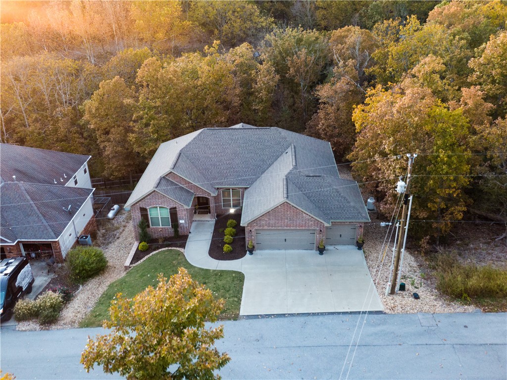 This gorgeous 4 BR 2 Bath home can now be yours! This immaculate 2018 Tall Oaks build is pure perfection. Open floorplan with wood scraped floors and modern tile in wet areas. The view is bar none! At the end of the street you have the greenway for walking and biking. The Back 40 and Blowing Springs are also nearby attractions that you could hop on your bike from home and enjoy! Don't wait on this home. Will go fast!
Please note - There is a large storage under the home that could be turned into a basement. Sellers had plans drawn up which I can share with you upon request to include a half bath, bonus room, and gym. Makes for great storage! Front door key opens the side door to this added bonus space. Sq Ftg is not included in the listing.